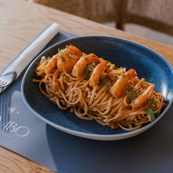 Seafood pasta with shrimp and tomato sauce, served at Mambo Beach Restaurant